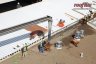 Telebelt truck installs rooflite extensive mc 100' away