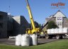 Lifting super sacks of rooflite drain with a crane directly from a flatbed tractor trailer