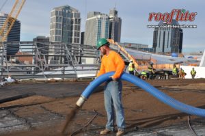 LSS installs rooflite green roof soil with a pneumatic blower truck at the Nashville Music City Center